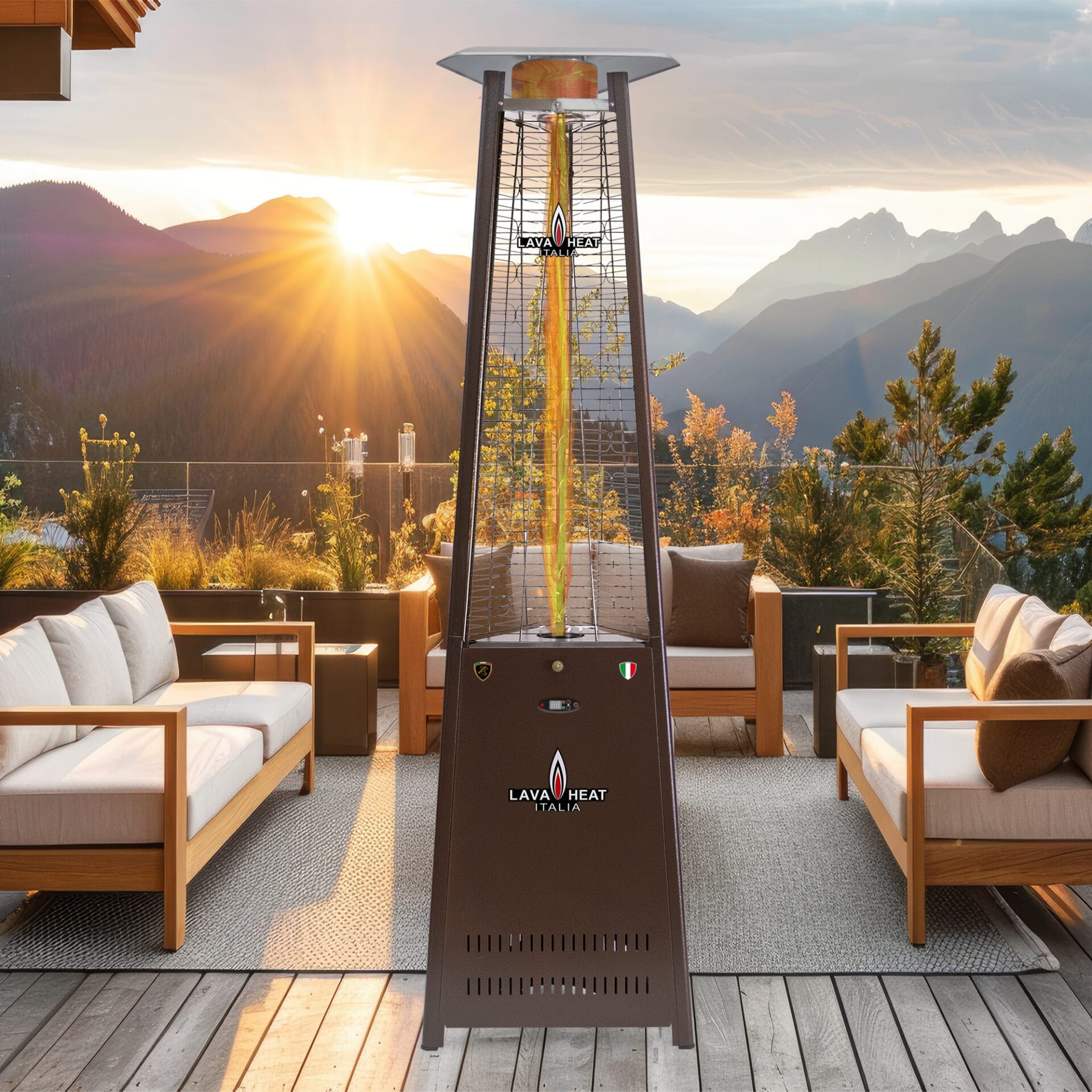 A bronze The 2G heater standing outdoors in front of sofas.