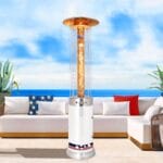 White Fire Fountain heater outdoors in front of sofas