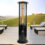 Black Opus heater outside in front of sofas at night